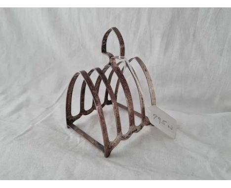 A five bar toast rack on bracket feet Sheffield 1933 84 gms 