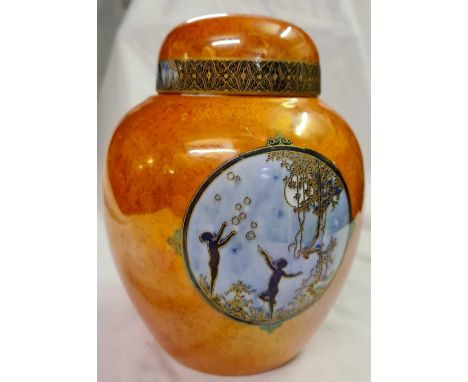 A Carlton ware jar and cover decorated with fairy's 6 1/2 inches high 