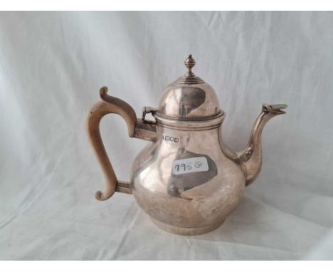 A Queen Anne style teapot pear shaped London 1909 600 gms 