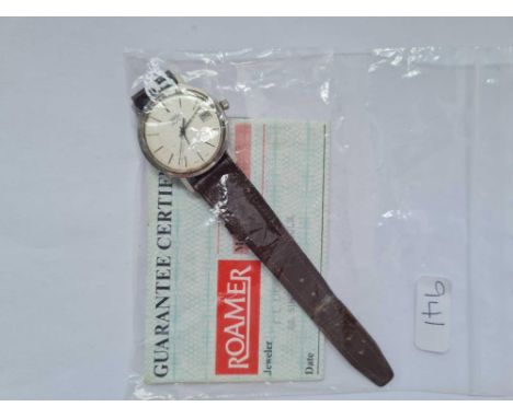 A gents Roamer quartz wrist watch with second sweep and calendar dial and papers 