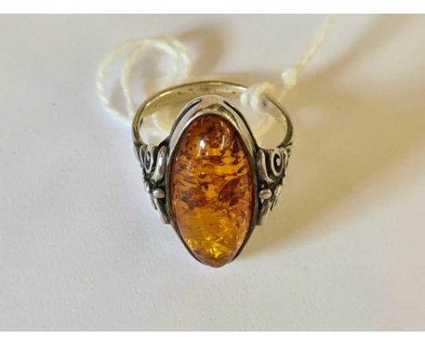 A silver oval amber ring 