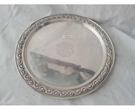 A Tiffaney and Co sterling silver salver with chased rim 11 inches dia 665 gms 