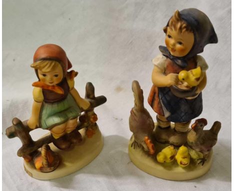 Two Hummel figures of girls one with chickens 