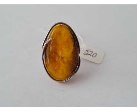 A large silver and amber ring size P 