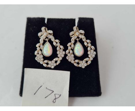 An attractive pair of silver, paste opal earrings