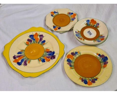 A Clarice Cliff Bizarre crocus pattern bread and butter plate 7 other plates and saucers 