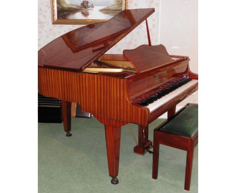 Wilhelm Steinmann  
A 5ft grand piano in a bright mahogany case on square tapered legs, together with a duet stool. 