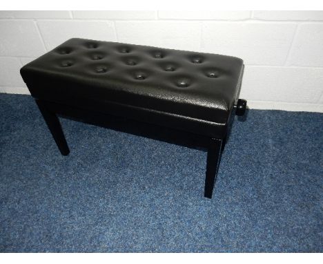 Piano Stool
A duet adjustable piano stool in a bright ebonised finish with storage under a buttoned down seat