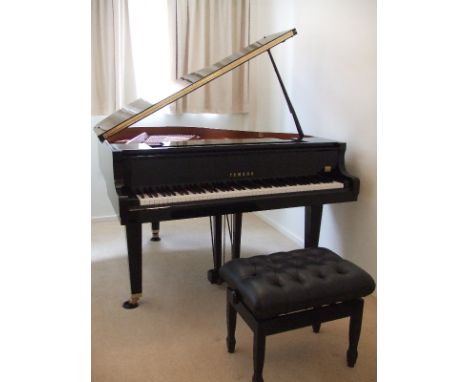 Yamaha (c2000) 
A 4ft 11in Model GB1 grand piano in an ebonised case, together with a matching stool.  AMENDMENT.  Is a Model