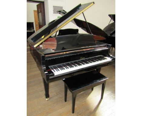 Boston (c2002)
A 5ft 2in Model GP 156 grand piano in a bright ebonised case on square tapered legs; together with a matching 