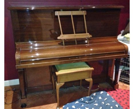 Steinway(c1922)
A Model K upright piano in a  mahogany case, together with a stool. 