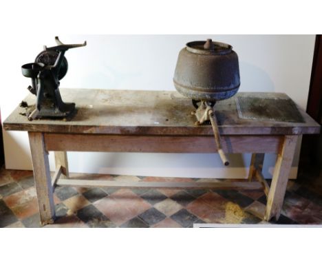 A large Milk Separator, on heavy metal floor stand, and a wooden Bench with two separators attached. As a lot. (1)