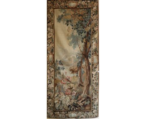 18th Century Flemish A wool Tapestry, depicting a colourful Landscape with trees and flowers in foreground and castle in the 