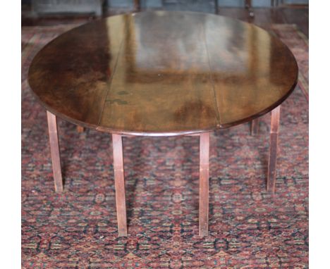 An extremely fine and large George III period Irish mahogany Hunting Table, with fine colour, and boule drop leaves, on squar