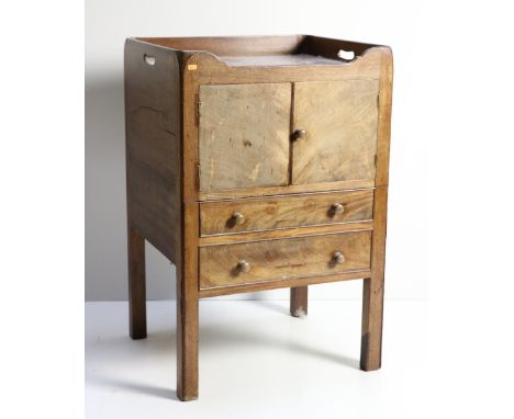 A Georgian period mahogany Bedside Commode, the gallery top over a press and two faux drawers on square tapering legs. (1)