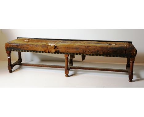 A large rectangular oak Footstool, of low proportions, with brass studs, a wooden standard Lamp, a wooden Bedside Locker, and