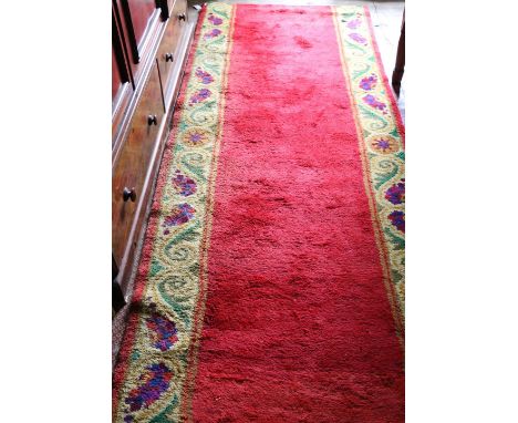 A good quality Irish woolen Carpet Set, by Dun Emer Guild Ltd of Dublin, the red ground central runner with yellow floral dec