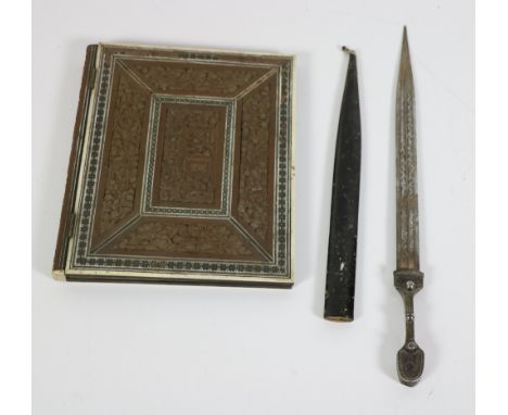 An early 20th Century steel North African Dagger and scabbard, the unusually designed handle with engraved blade, approx. 30c