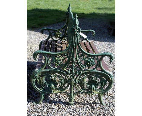 A rare and unusual 19th Century heavy cast iron double sided Garden Bench, with flower head, foliate and shell decoration, an