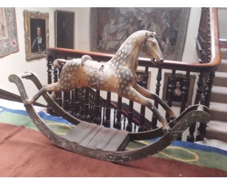 A large Victorian period painted wooden Rocking Horse, approx. 213cms l x 124cms h x 84cms (7' x 49" x 33") from saddle to pl
