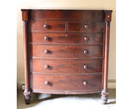 A Victorian mahogany bow fronted Scotch type Chest, of two short and four graduating long drawers with circular handles, flan