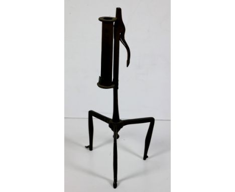 A late 18th Century Irish steel Rush Fire Light on tripod base. (1)