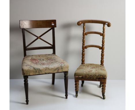 An unusual Victorian walnut Prie-dieu, the ladder back with turned support on bobbin front legs with brass castors; together 