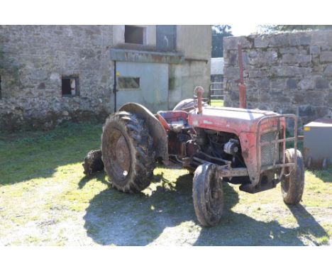 A c. 1950's Ferugson 35 Tractor, with Log Book, together with Scraper. (1)N.B. Should read: Massey Ferguson 35 1964N.B. The S