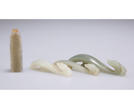 THREE CHINESE JADE SMALL BELT HOOKS, each with dragon's head hook, largest 7.3cm; together with A CHINESE CARVED JADE PENDANT