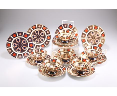 A SET OF ROYAL CROWN DERBY IMARI TEACUPS, SAUCERS AND TEA PLATES, for six settings, pattern no. 1128, the cups with scratched