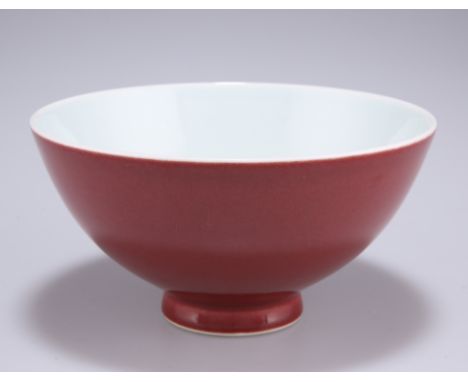 A CHINESE SANG DE BOEUF PORCELAIN BOWL, circular with slightly everted short foot, bears underglaze blue seal mark. 15cm diam