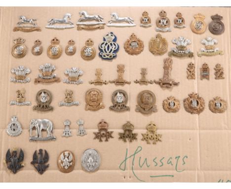 A COLLECTION OF CAP BADGES, COLLAR BADGES AND ARM BADGES, of regiments of Hussars of the British Army, on card.&nbsp;(49)