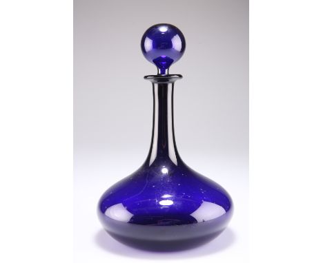 AN EARLY 19TH CENTURY BRISTOL BLUE GLASS DECANTER AND STOPPER, of squat globe and shaft form with spherical stopper. 25.5cm h