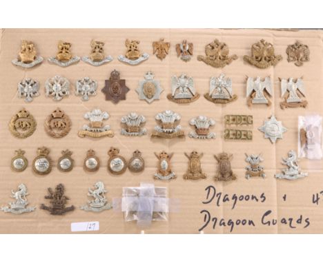 A COLLECTION OF CAP BADGES, COLLAR BADGES AND ARM BADGES,&nbsp;of regiments of Dragoons and Dragoon Guards of the British Arm
