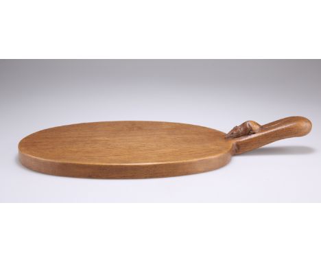 ROBERT THOMPSON, A MOUSEMAN OAK CHEESEBOARD, adzed oval form with carved mouse signature to the handle. 40cm overallCONDITION