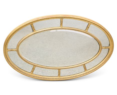 AN 18TH CENTURY STYLE GILT-GESSO OVAL MIRROR, the section plate with bead and leaf borders. 62cm by 99cm