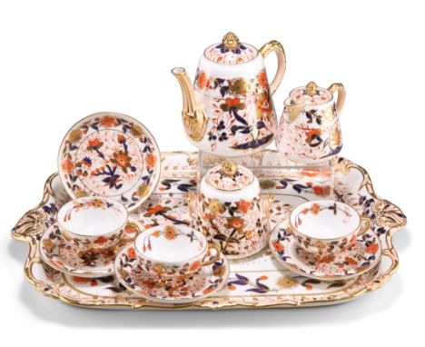 A DAVENPORT PORCELAIN TEA SERVICE, CIRCA 1870-1886, comprising tray, teapot, cream jug, sucrier, three cups and four saucers,