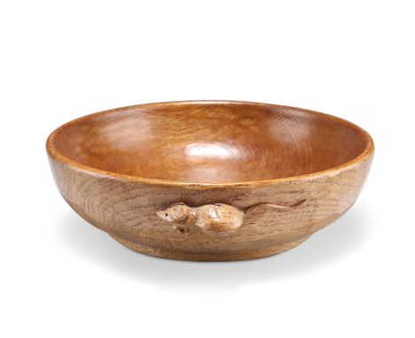 ROBERT THOMPSON, A MOUSEMAN OAK FRUIT BOWL, circular, with adzed exterior and carved mouse signature. 22.5cm diameterCONDITIO