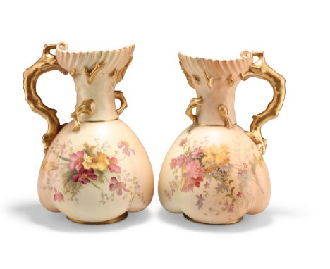 A NEAR PAIR OF ROYAL WORCESTER BLUSH IVORY JUGS, 1908,&nbsp;of lobed globular form with coral twig handles, painted in polych