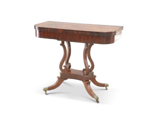 A REGENCY MAHOGANY FOLDOVER CARD TABLE, the rounded rectangular top with rosewood banding, raised on four reeded S-scroll sup