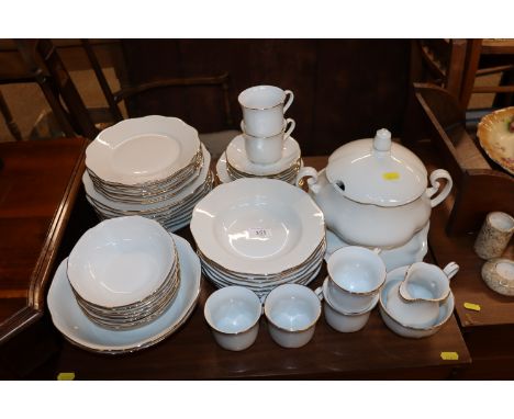 A Czechoslovakian Bohemia white and gilt rimmed tea and dinner service