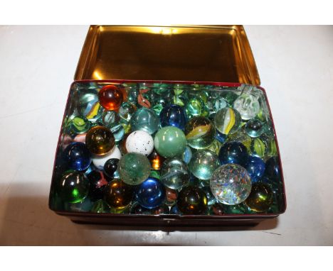 A tin of various marbles