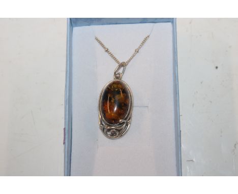 A vintage Sterling silver and amber pendant necklace 