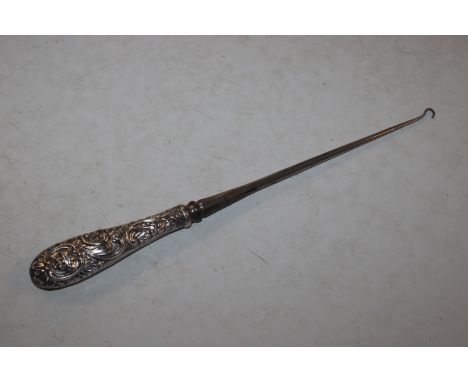 A 13" Victorian silver handled button hook, London 1891