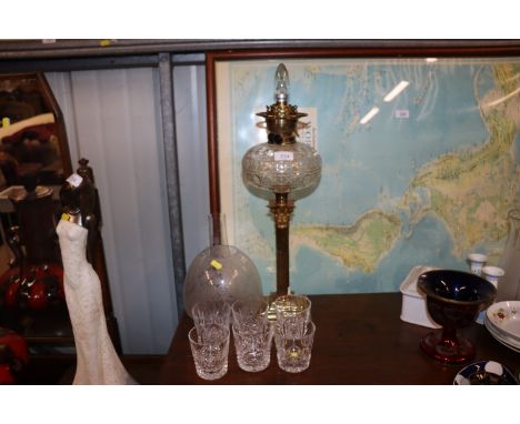 A brass Corinthian column table lamp in the style of an oil lamp, with chimney and shade (shade AF); and six cut glass spirit
