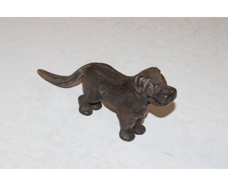 A vintage nut cracker in the form of a dog