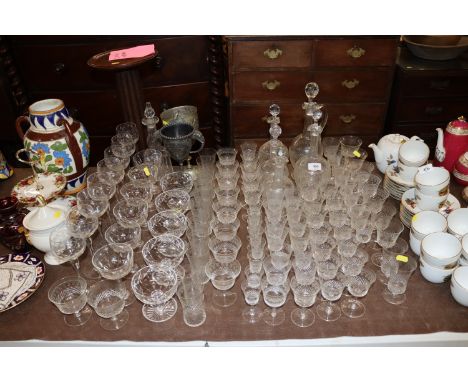 A quantity of Pall Mall patterned glassware; Champagne saucers, silver plated trophy cups etc.