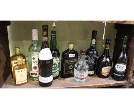 A shelf full of alcoholic beverage 