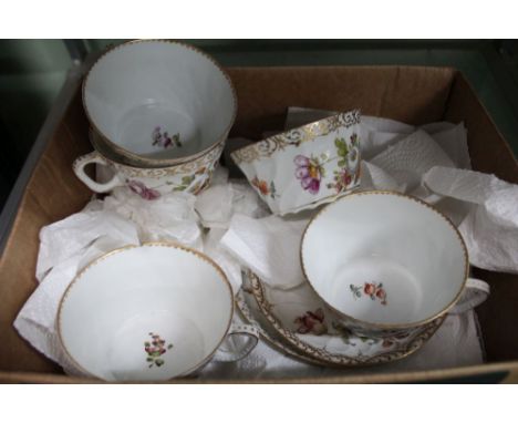 A box containing a continental porcelain hand painted selection of cups and saucers bearing the label Dresden 