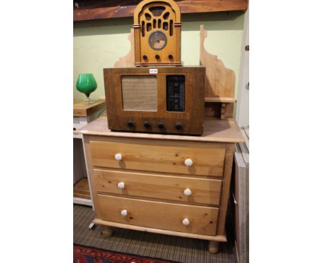 An early 20th-century stripped pine dressing chest, with plain plate mirrored back display, shelf base unit having drawers on